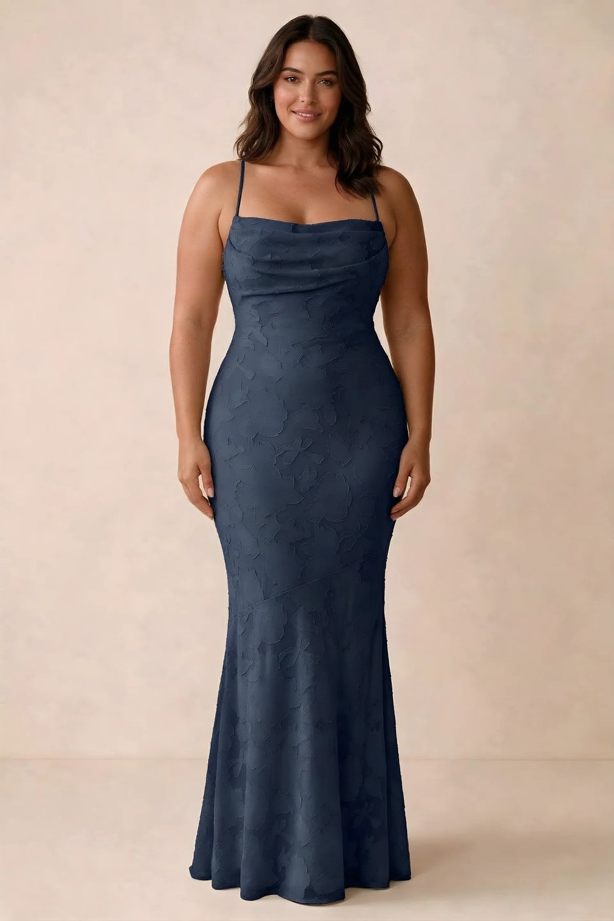 Front studio view of Bess navy maxi dress showing tonal floral texture and a long skirt
