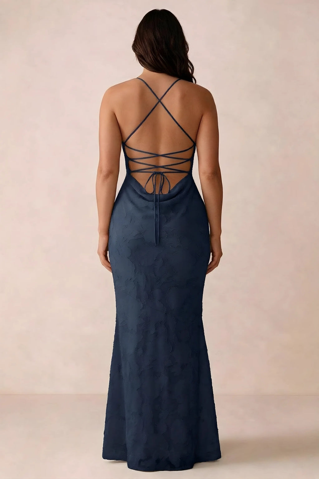 Back studio view of Bess navy dress showing the crossed straps and full-length silhouette