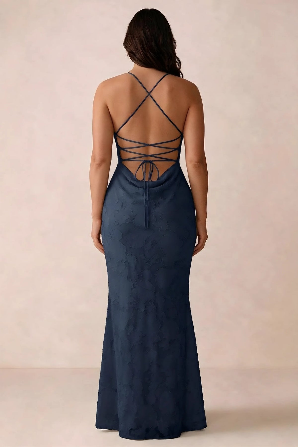 Back studio view of Bess navy dress showing the crossed straps and full-length silhouette
