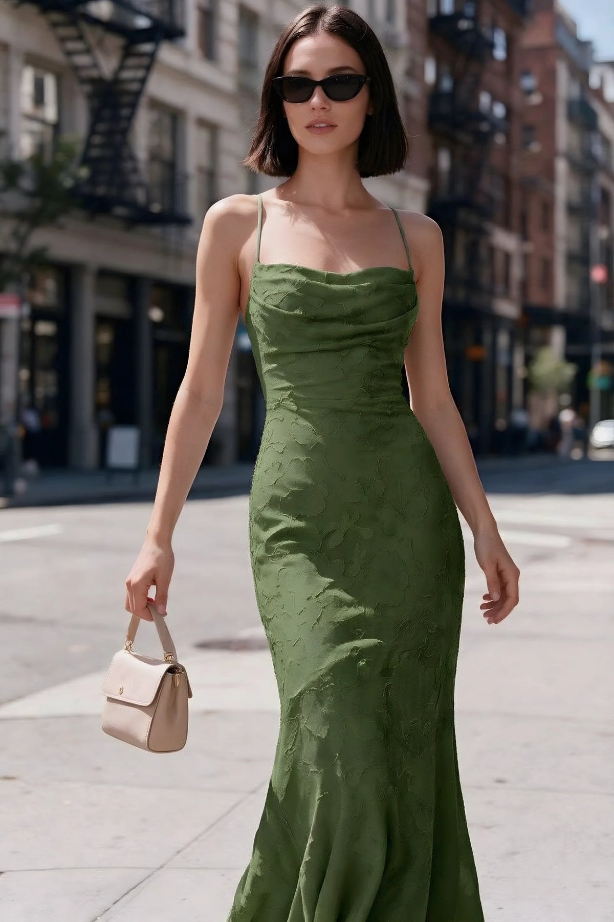 Outdoor front view of Bess olive floral burnout dress styled with sunglasses on a city street