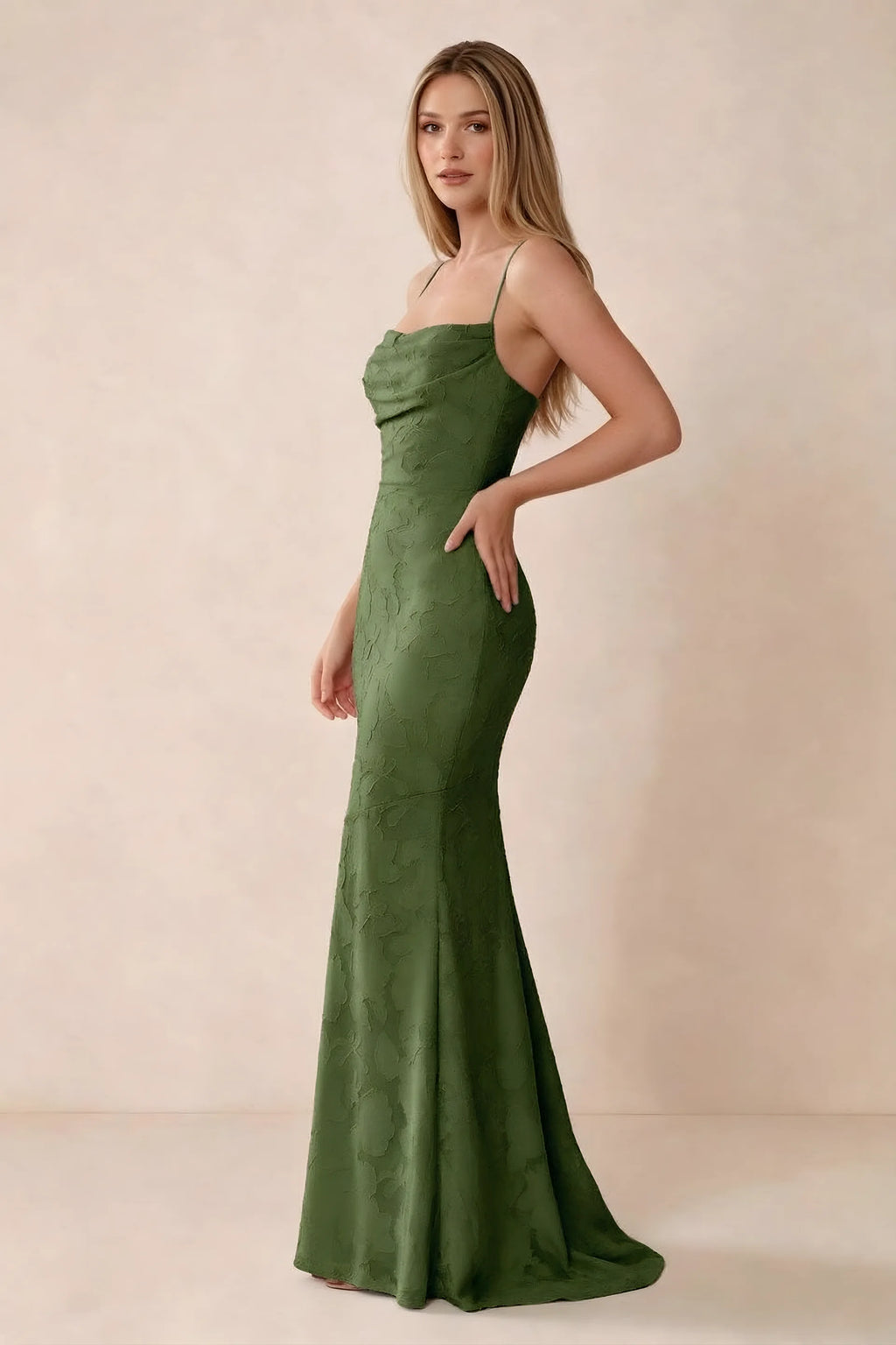 Three-quarter studio view of Bess olive dress showing the close-fitting waist and gently flared hem