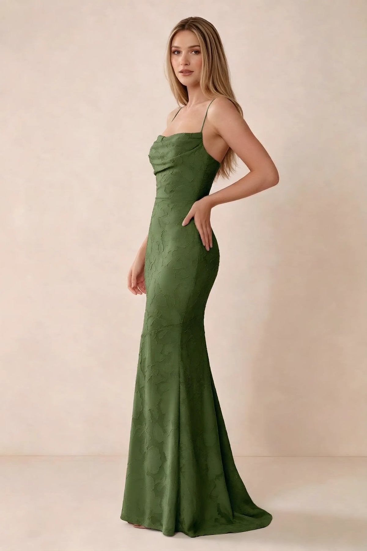 Three-quarter studio view of Bess olive dress showing the close-fitting waist and gently flared hem