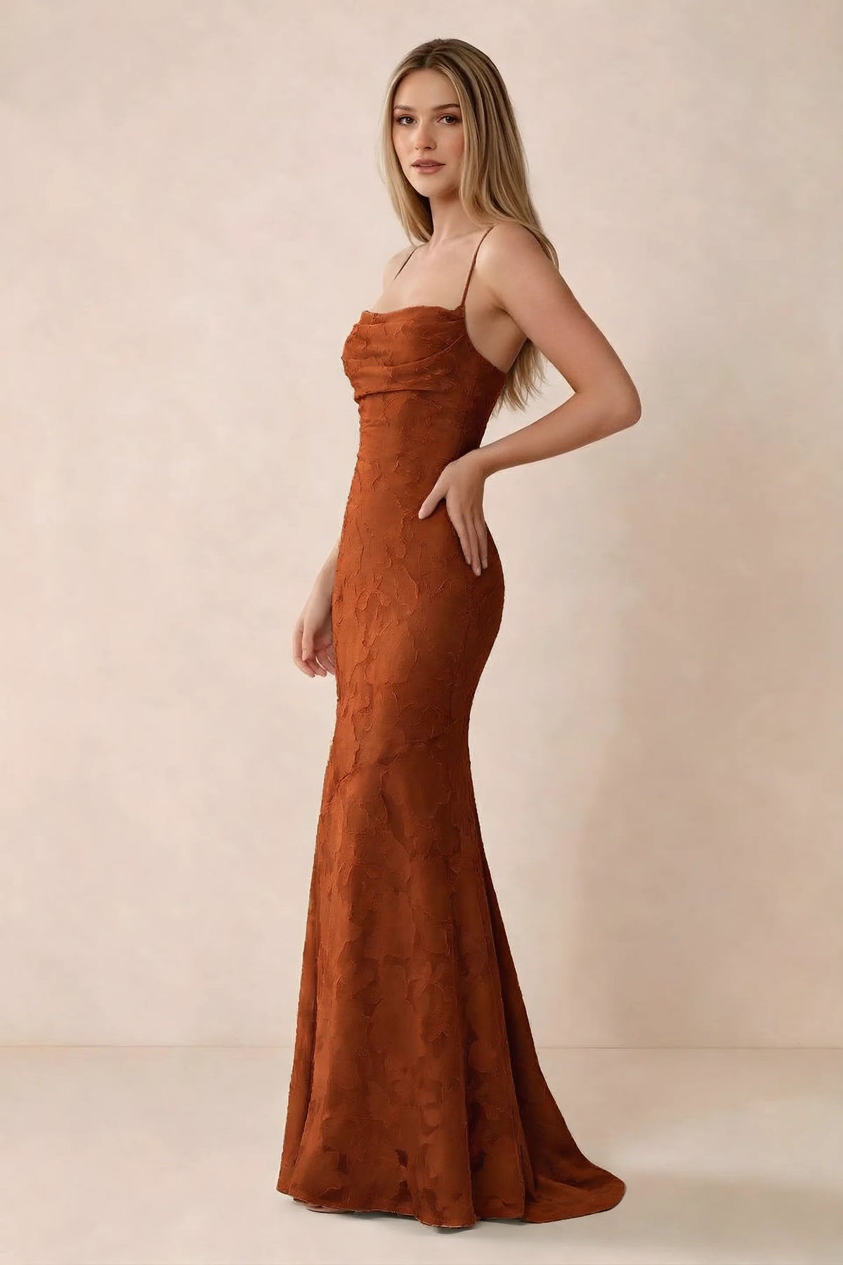 Three-quarter studio view of Bess paprika dress showing the close-fitting waist and gently flared hem
