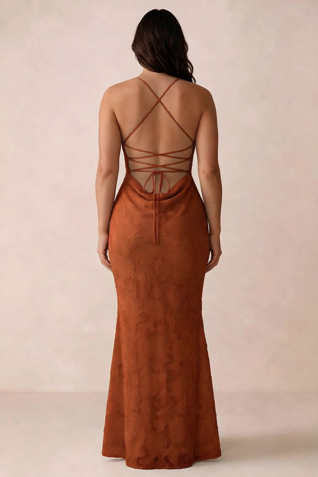 Back studio view of Bess paprika dress showing the crossed straps and full-length silhouette