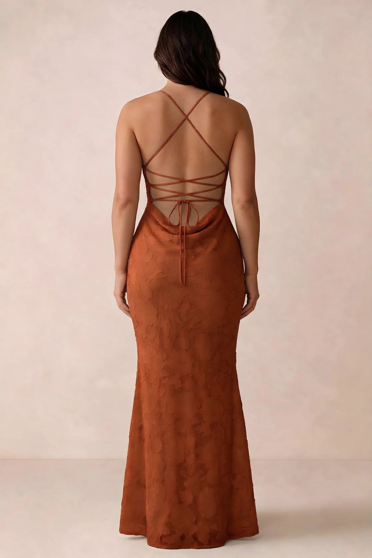 Back studio view of Bess paprika dress showing the crossed straps and full-length silhouette