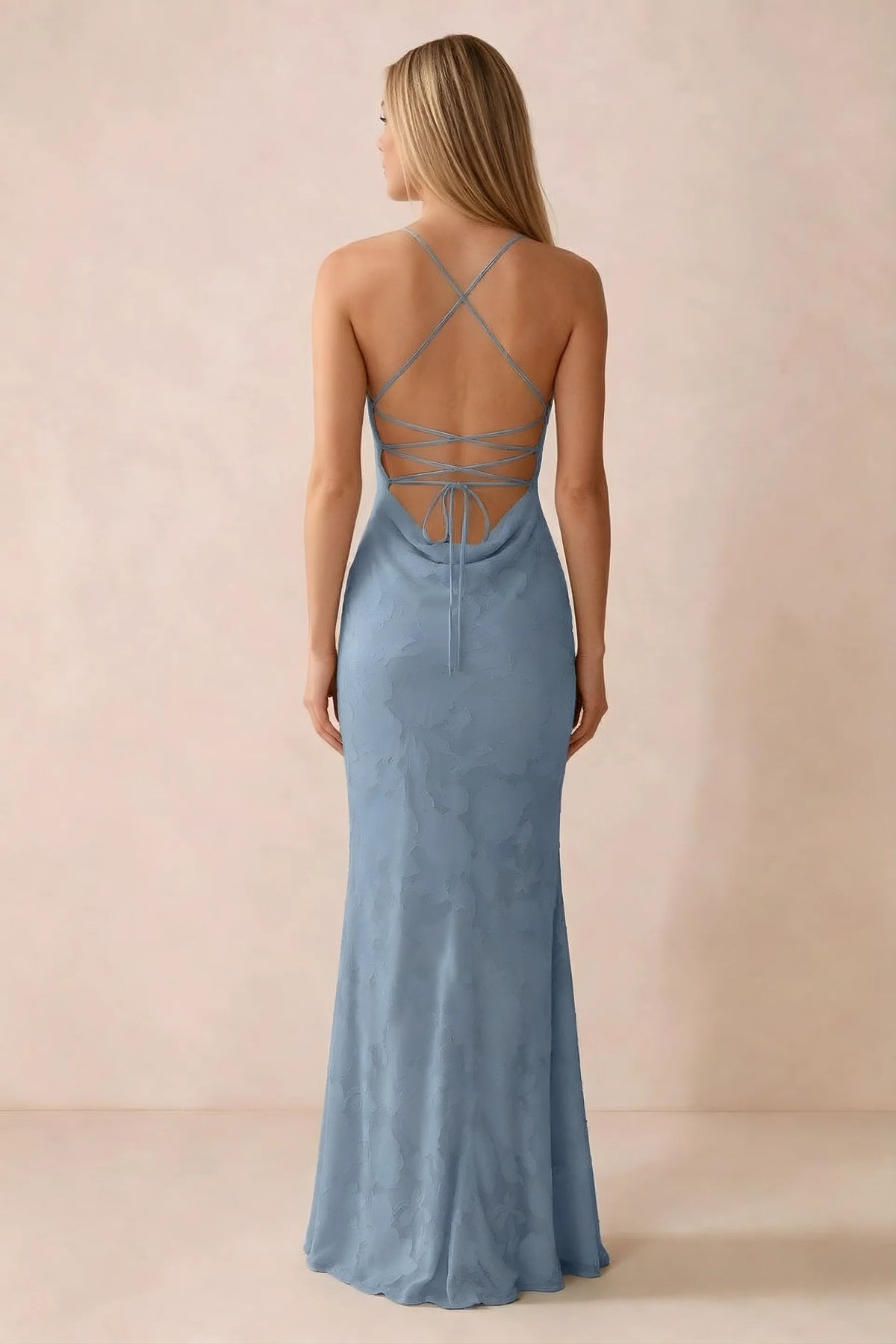 Rear studio view of Bess powder blue dress showing cross-back lacing above a low cowl drape