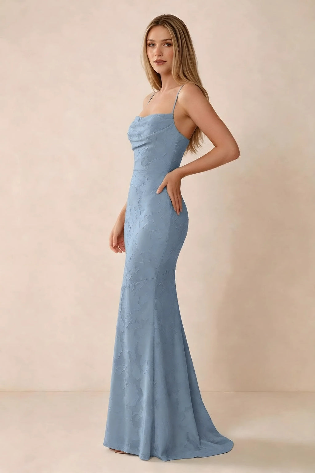 Three-quarter studio view of Bess powder blue dress showing the close-fitting waist and gently flared hem