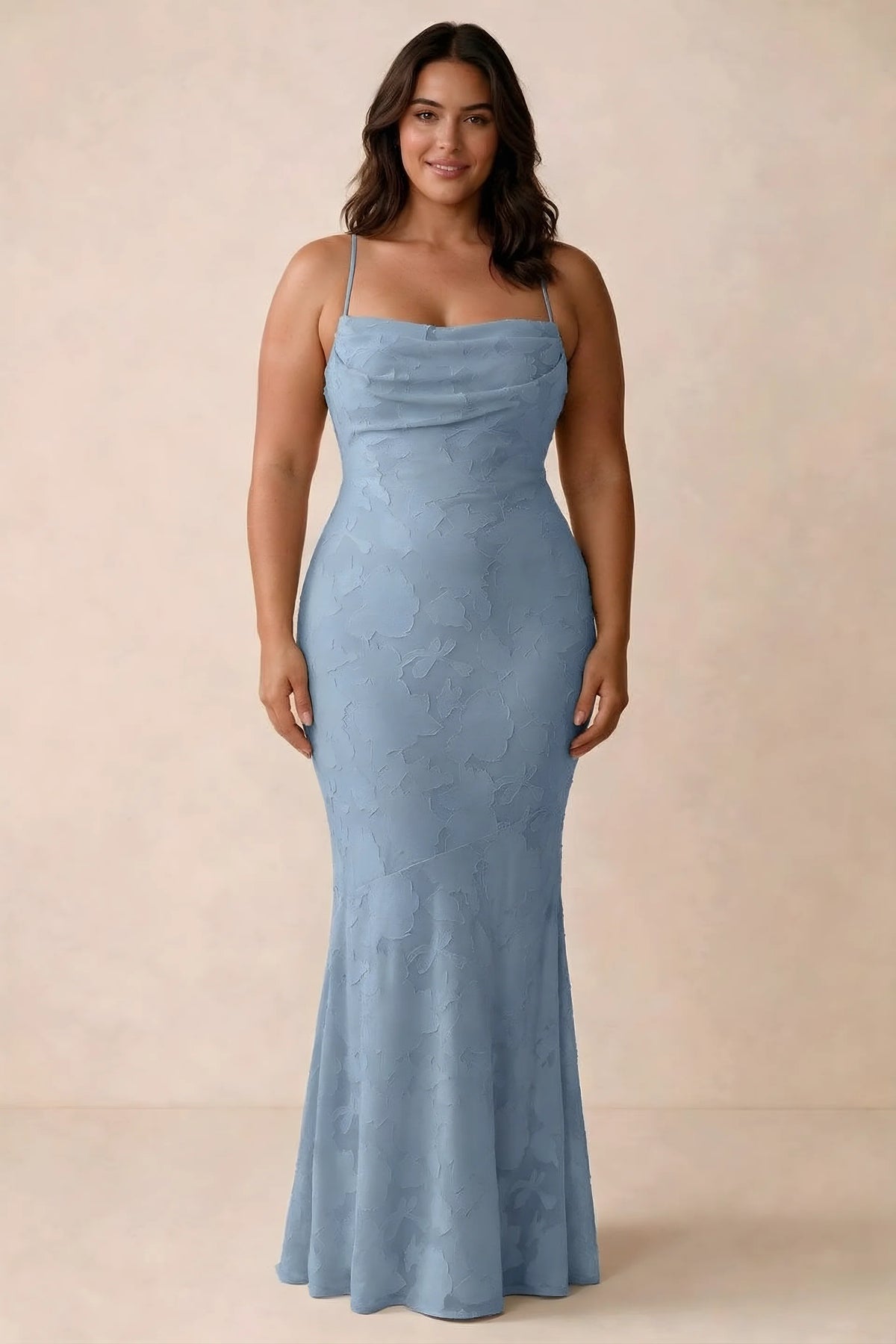 Front studio view of Bess powder blue maxi dress showing tonal floral texture and a long skirt