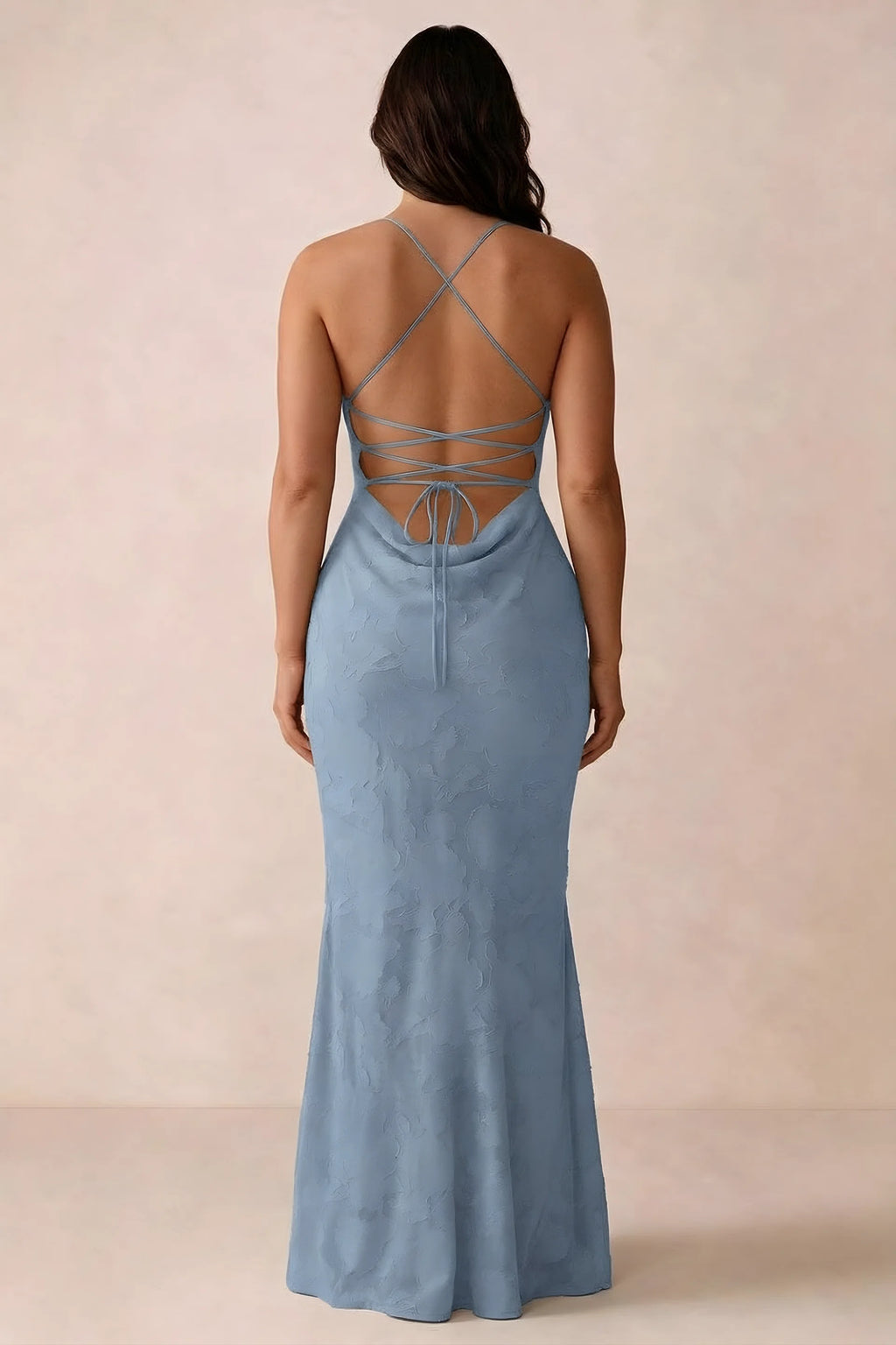 Back studio view of Bess powder blue dress showing the crossed straps and full-length silhouette