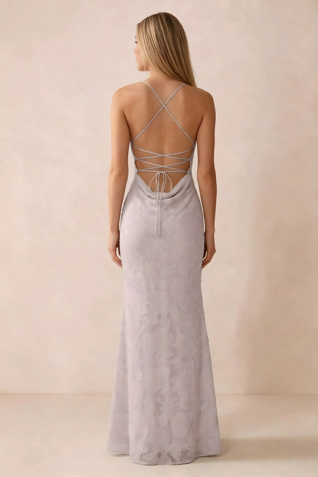 Rear studio view of Bess powder pink dress showing cross-back lacing above a low cowl drape