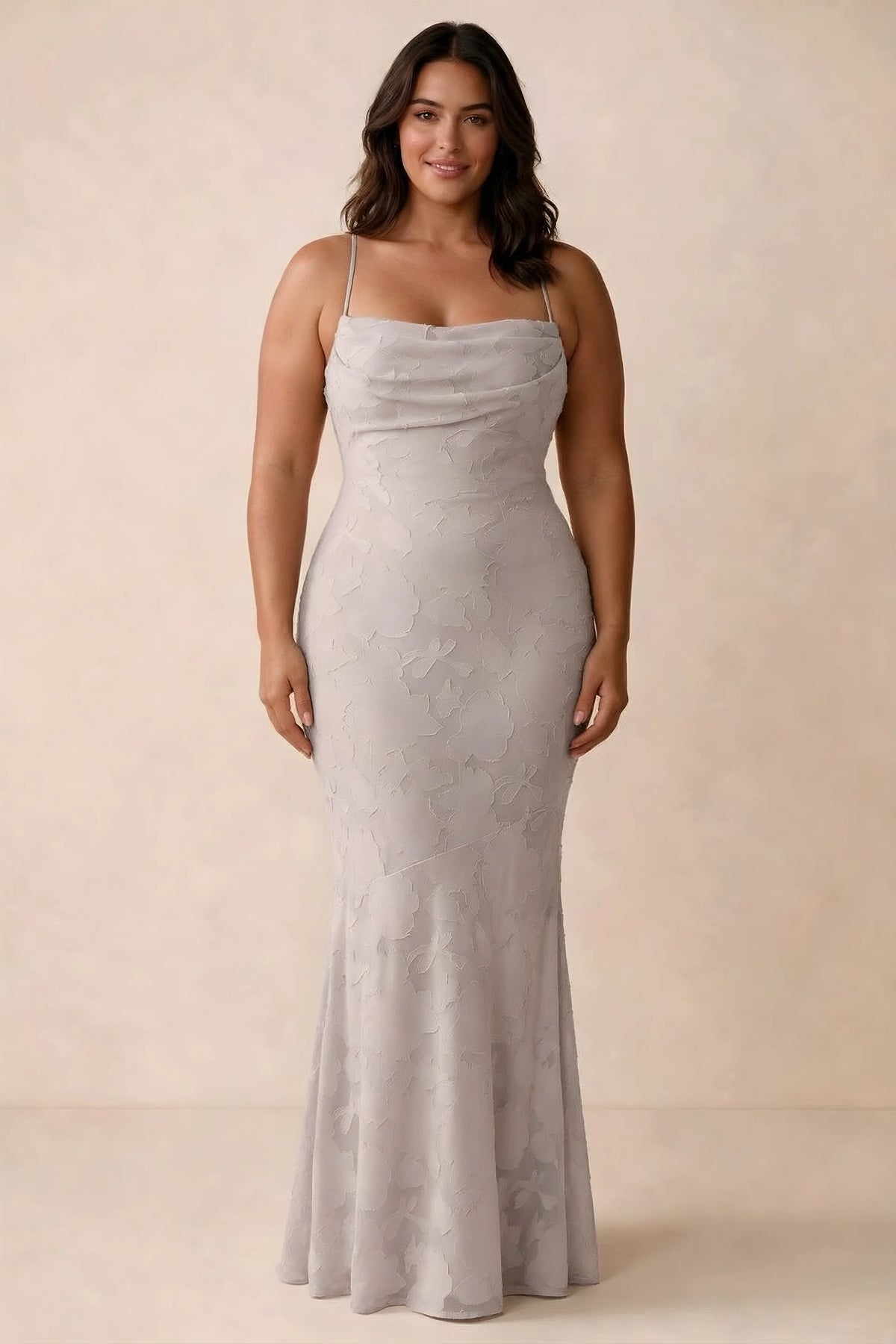 Front studio view of Bess powder pink maxi dress showing tonal floral texture and a long skirt