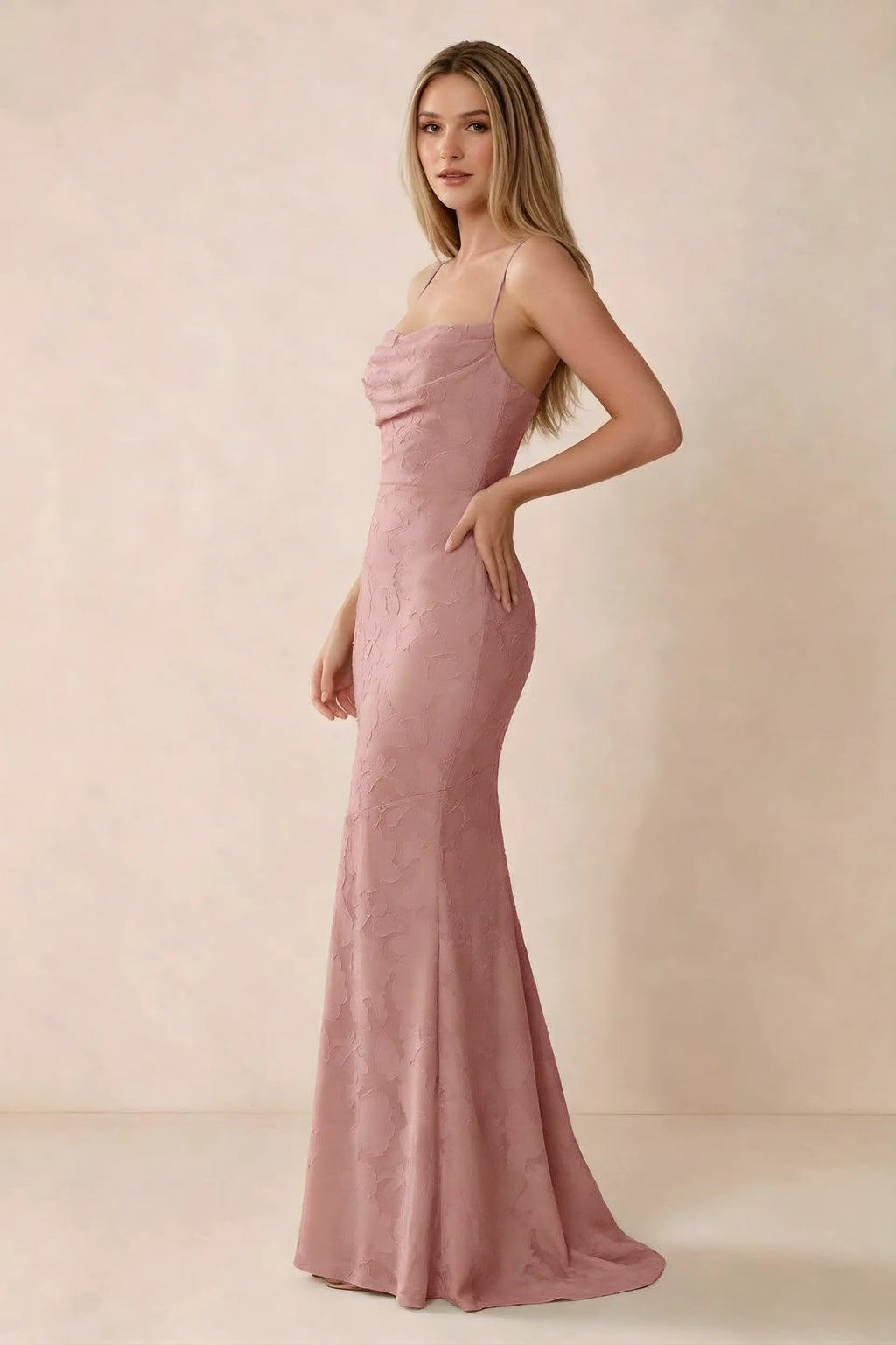 Three-quarter studio view of Bess rosette dress showing the close-fitting waist and gently flared hem