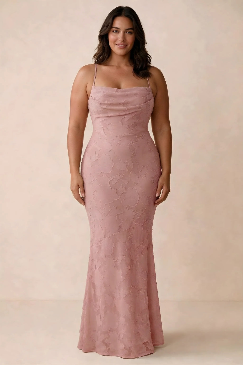 Front studio view of Bess rosette maxi dress showing tonal floral texture and a long skirt