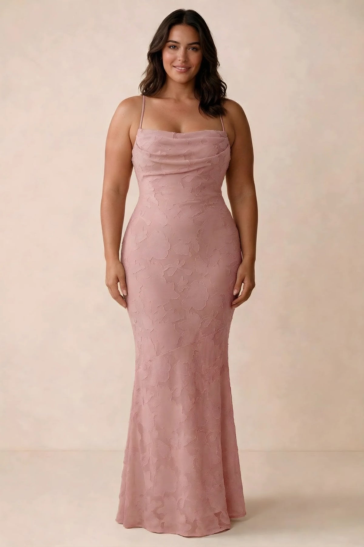Front studio view of Bess rosette maxi dress showing tonal floral texture and a long skirt