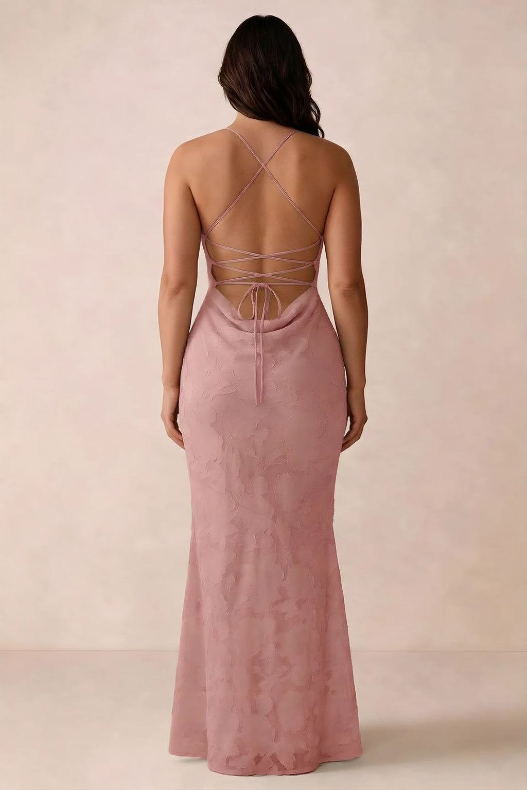 Back studio view of Bess rosette dress showing the crossed straps and full-length silhouette