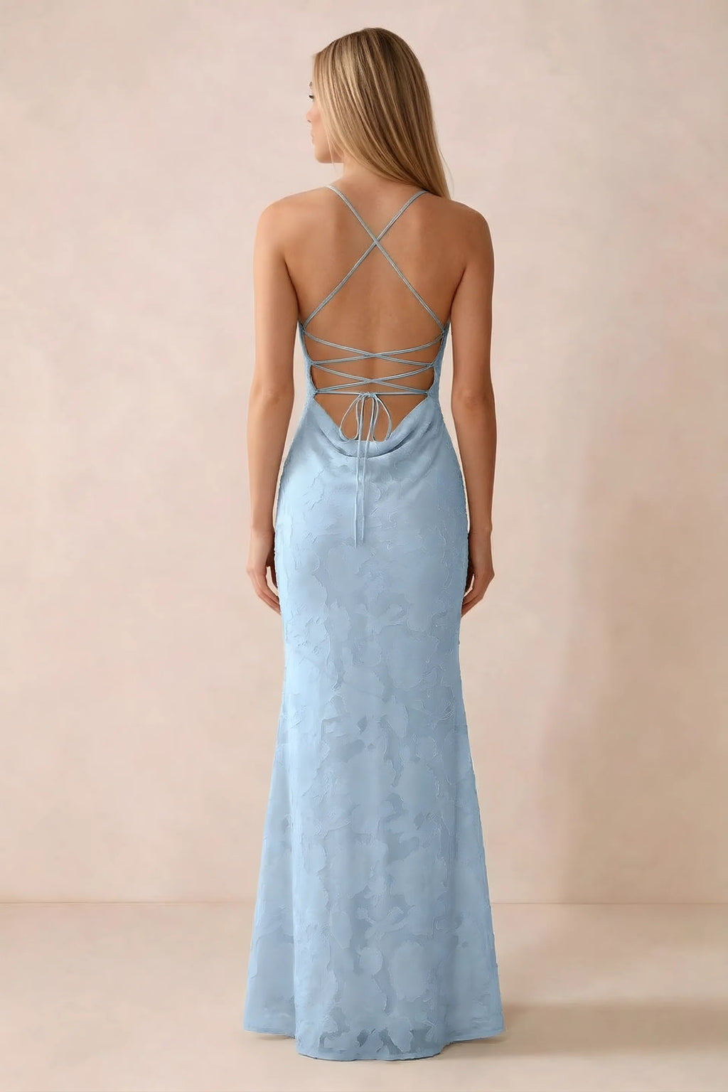 Rear studio view of Bess sky blue dress showing cross-back lacing above a low cowl drape