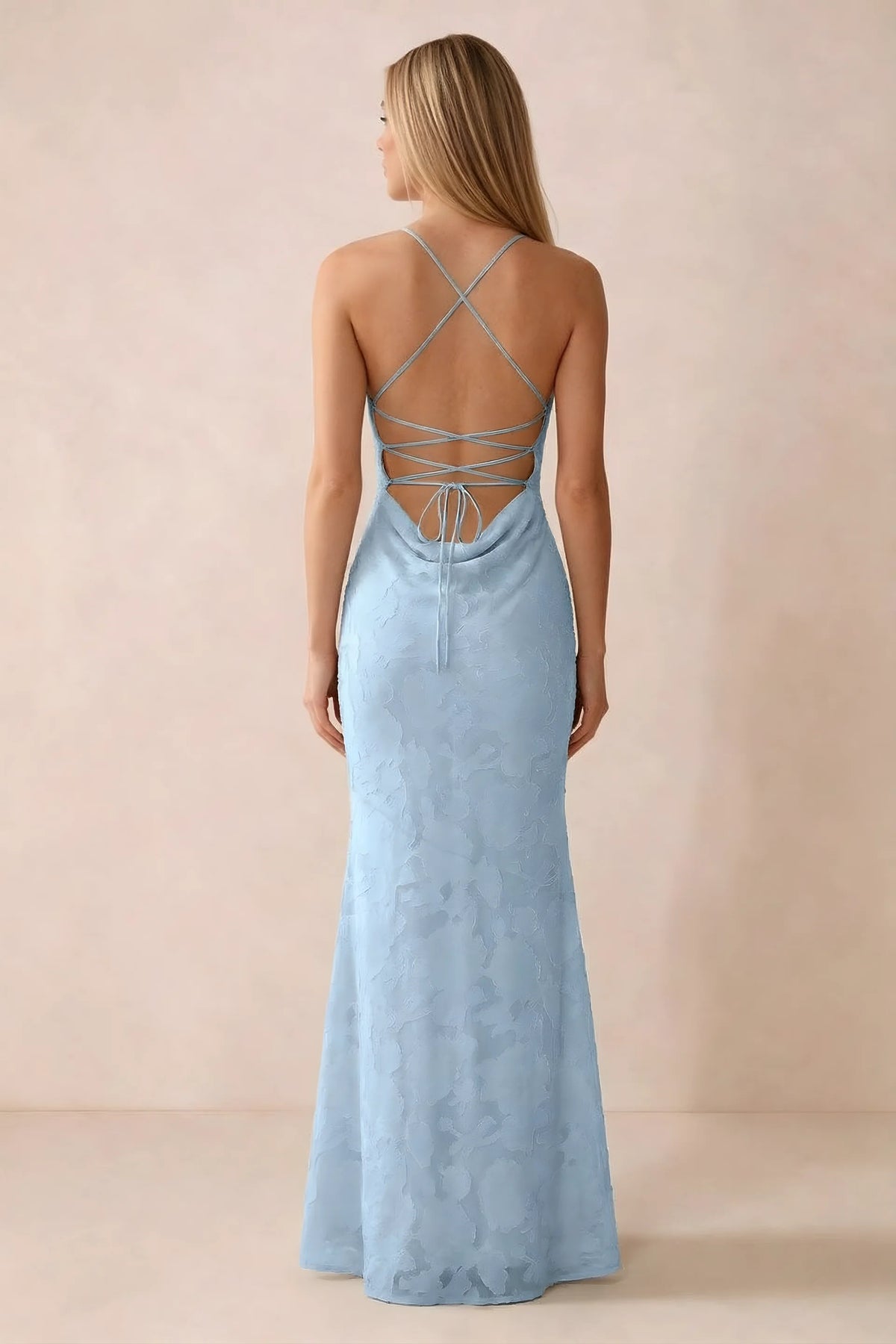 Rear studio view of Bess sky blue dress showing cross-back lacing above a low cowl drape