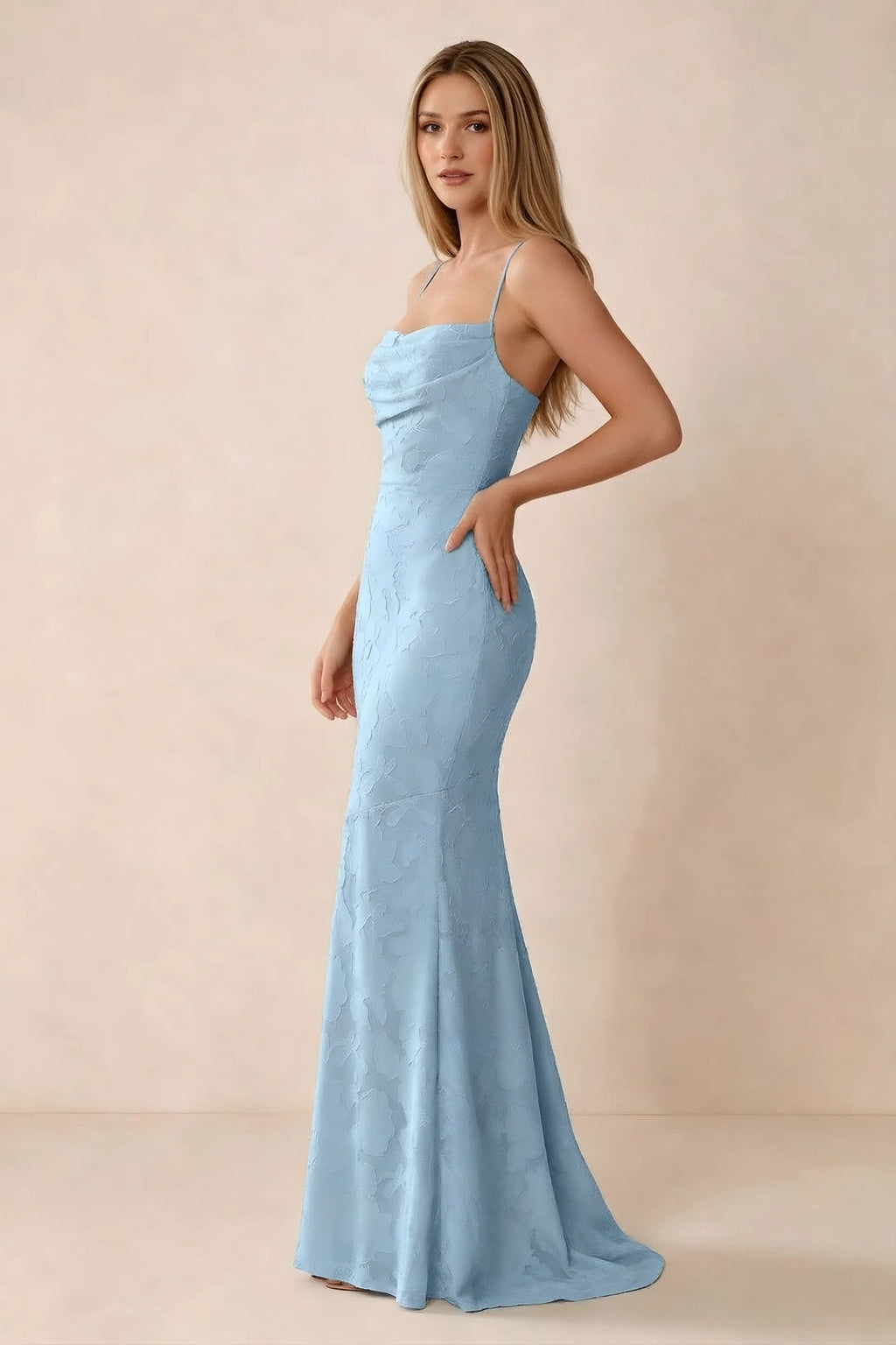 Three-quarter studio view of Bess sky blue dress showing the close-fitting waist and gently flared hem