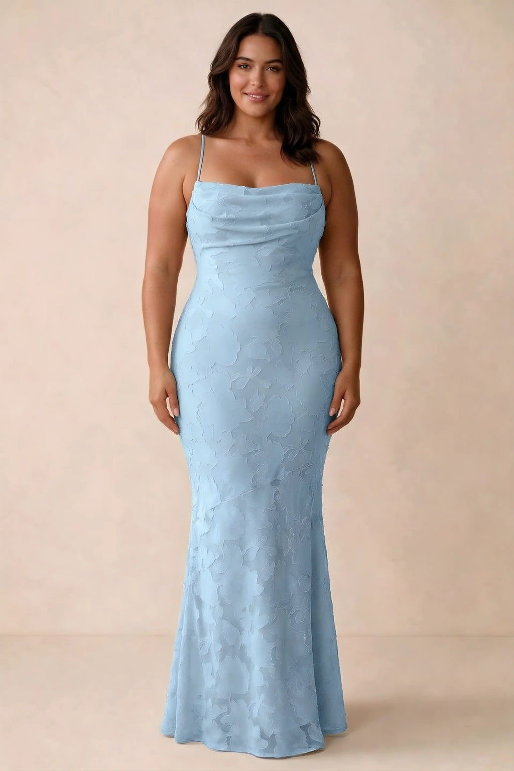 Front studio view of Bess sky blue maxi dress showing tonal floral texture and a long skirt
