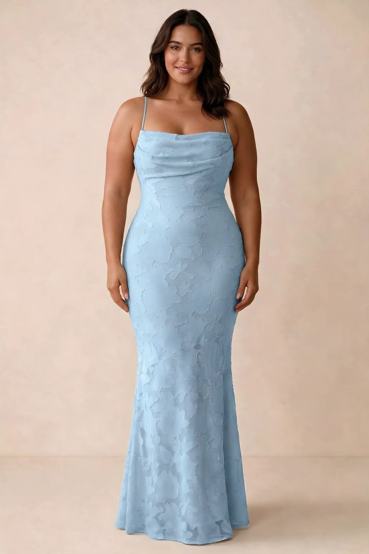 Front studio view of Bess sky blue maxi dress showing tonal floral texture and a long skirt