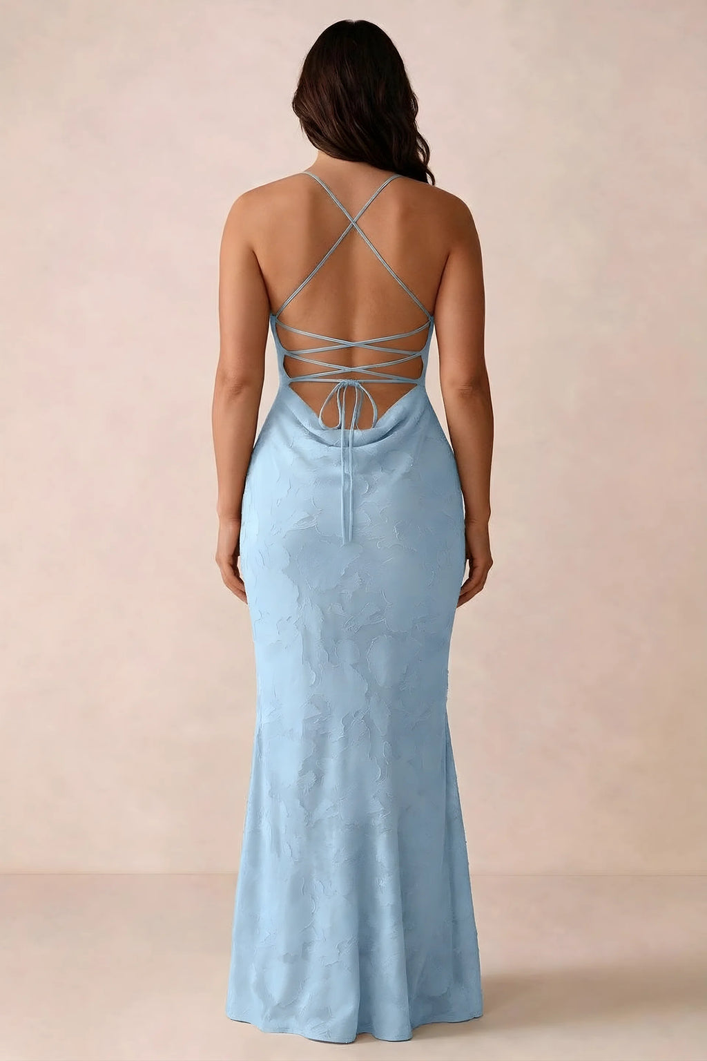Back studio view of Bess sky blue dress showing the crossed straps and full-length silhouette
