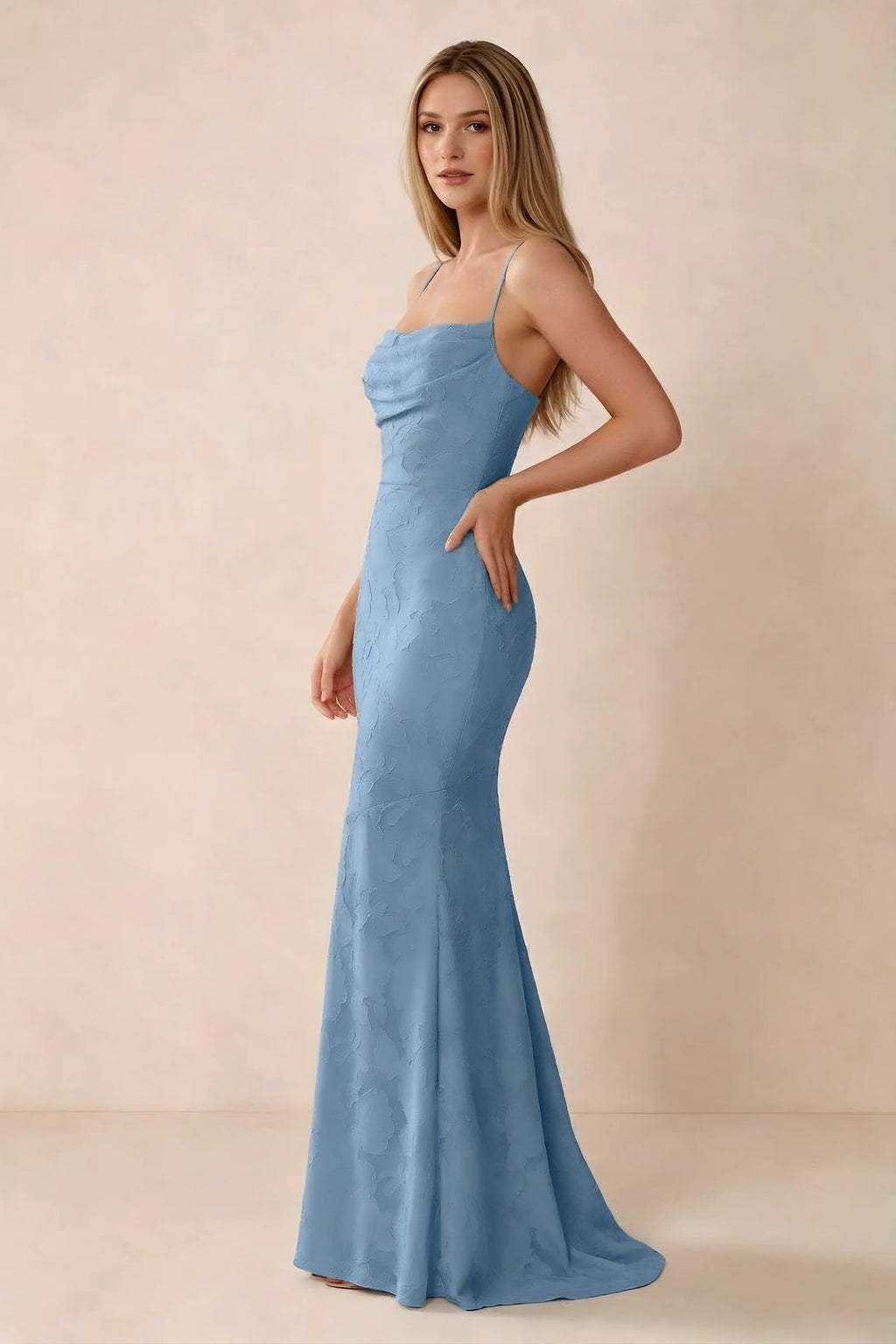 Three-quarter studio view of Bess steel blue dress showing the close-fitting waist and gently flared hem