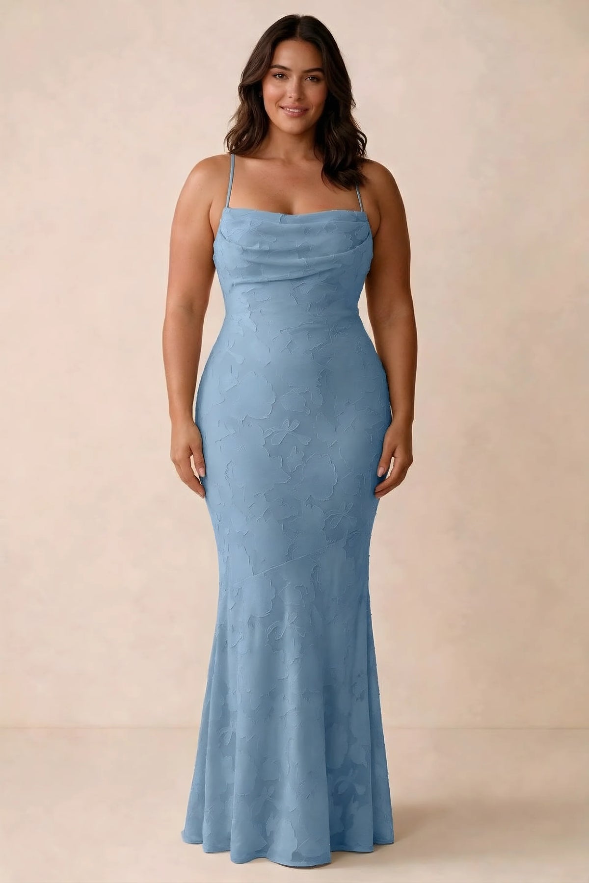 Front studio view of Bess steel blue maxi dress showing tonal floral texture and a long skirt