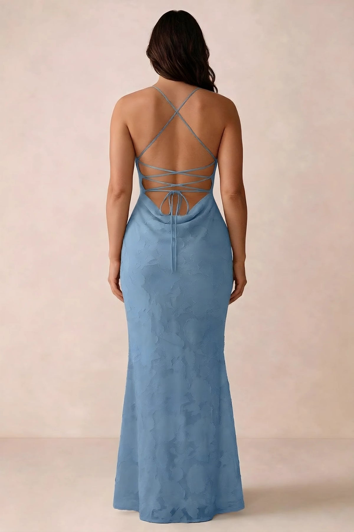 Back studio view of Bess steel blue dress showing the crossed straps and full-length silhouette
