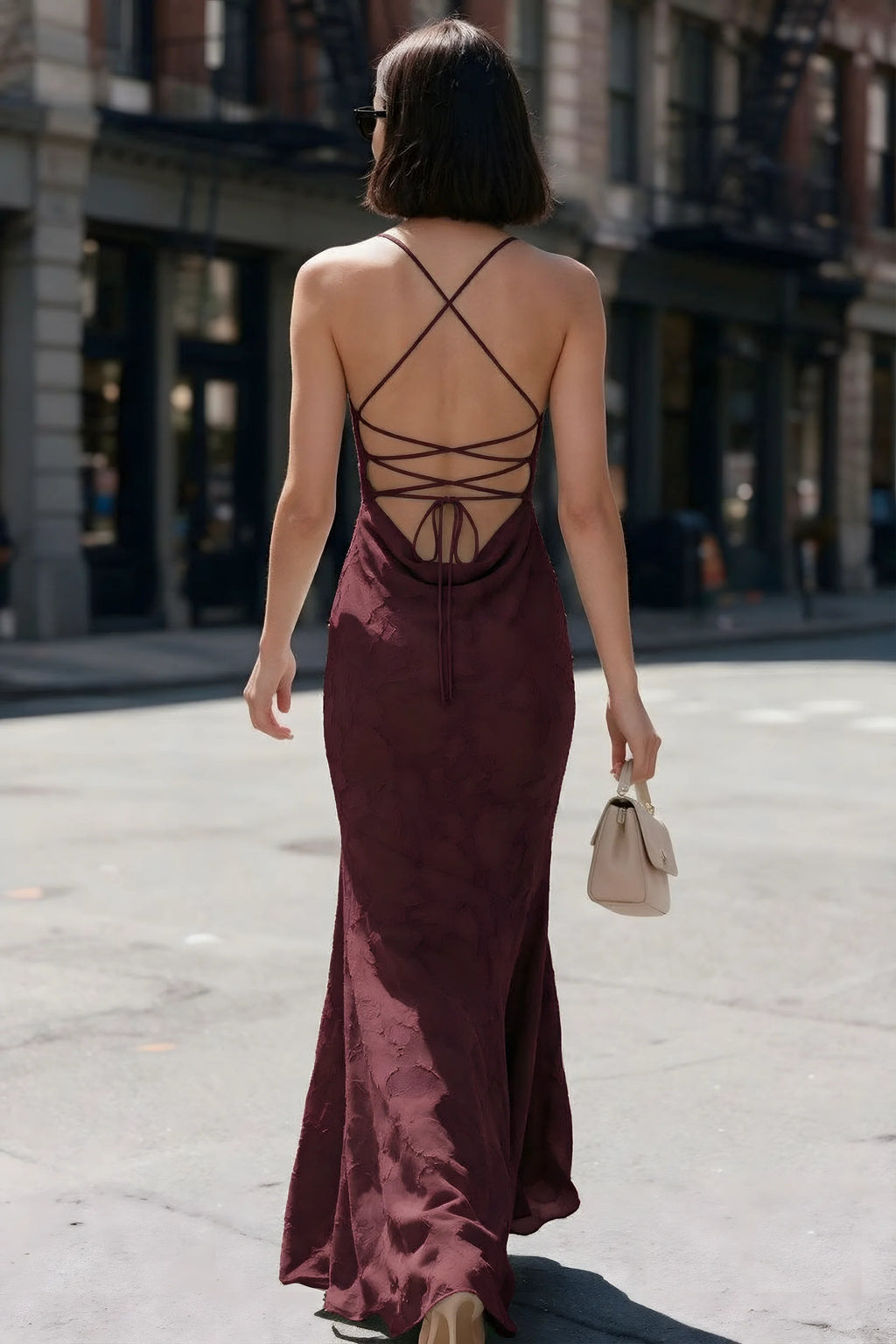 Outdoor back view of Bess wine maxi dress showing the open back and crisscross ties