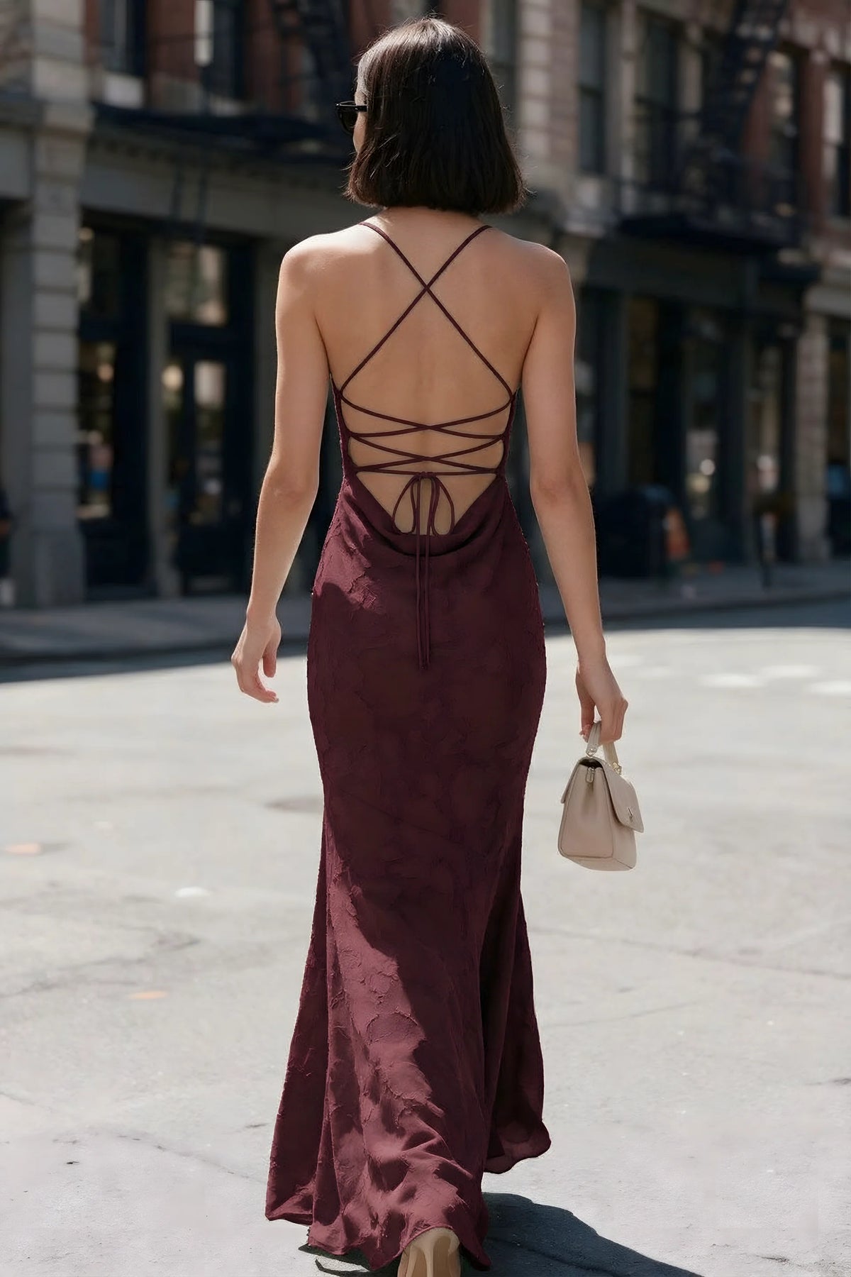 Outdoor back view of Bess wine maxi dress showing the open back and crisscross ties