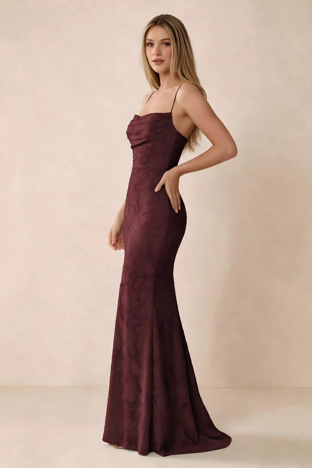 Three-quarter studio view of Bess wine dress showing the close-fitting waist and gently flared hem