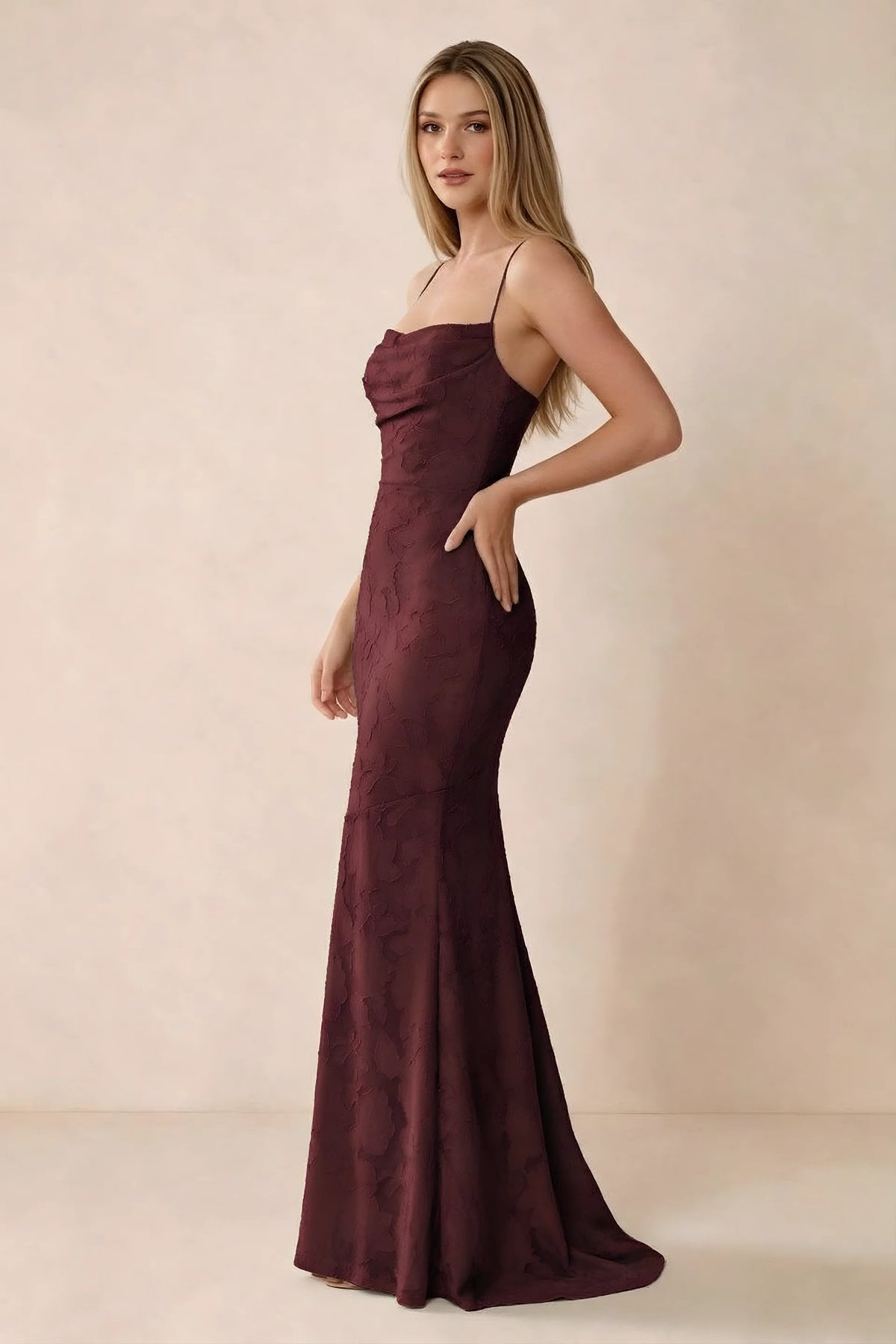 Three-quarter studio view of Bess wine dress showing the close-fitting waist and gently flared hem