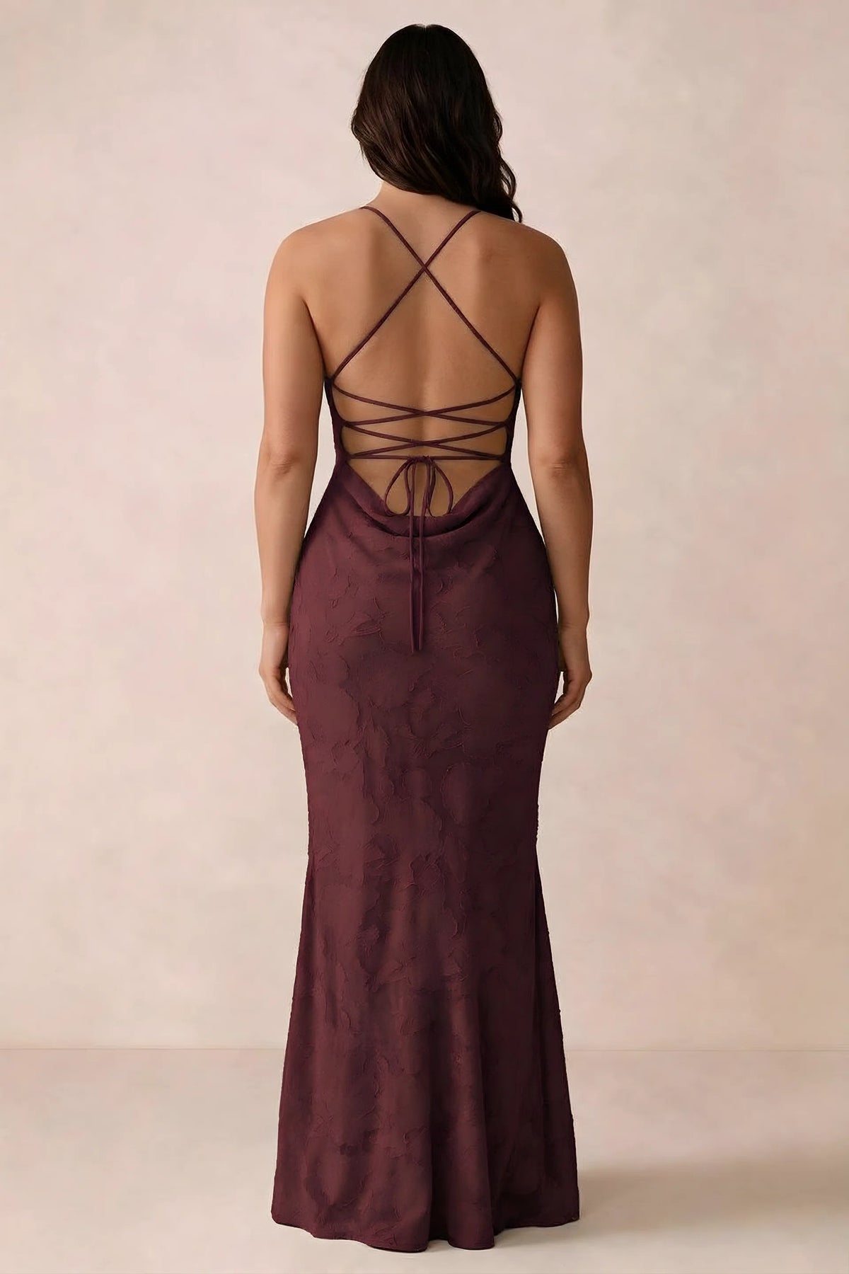Back studio view of Bess wine dress showing the crossed straps and full-length silhouette