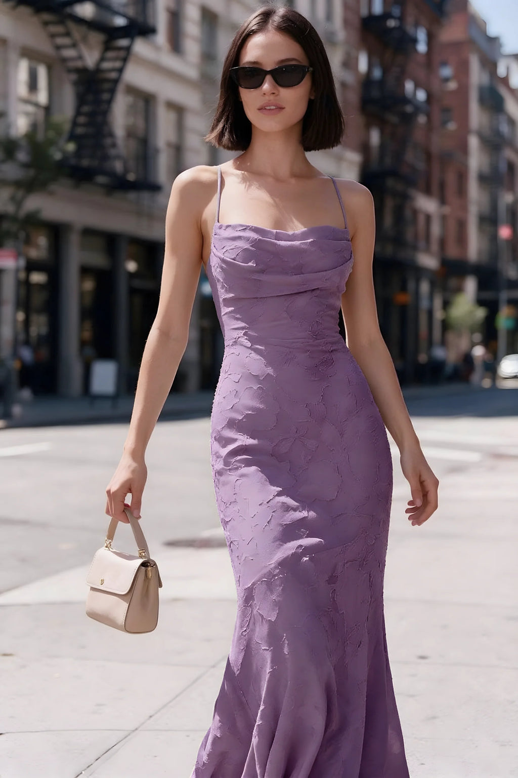 Outdoor front view of Bess wisteria floral burnout dress styled with sunglasses on a city street