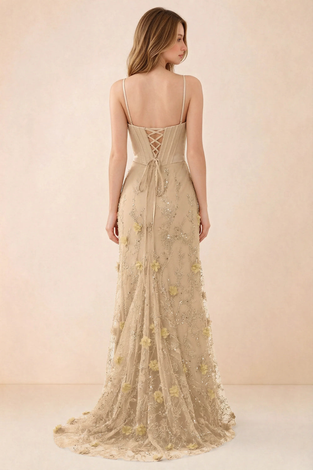 Translation missing: es.Rear studio view of Beth champagne dress showing corset back lacing and a trailing floral hem content.product_image_secondary