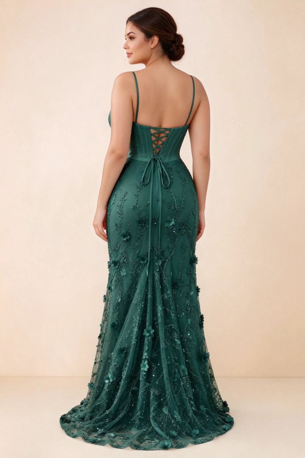 Rear studio view of Beth dark green corset dress with fine straps, back ties and a trailing hem