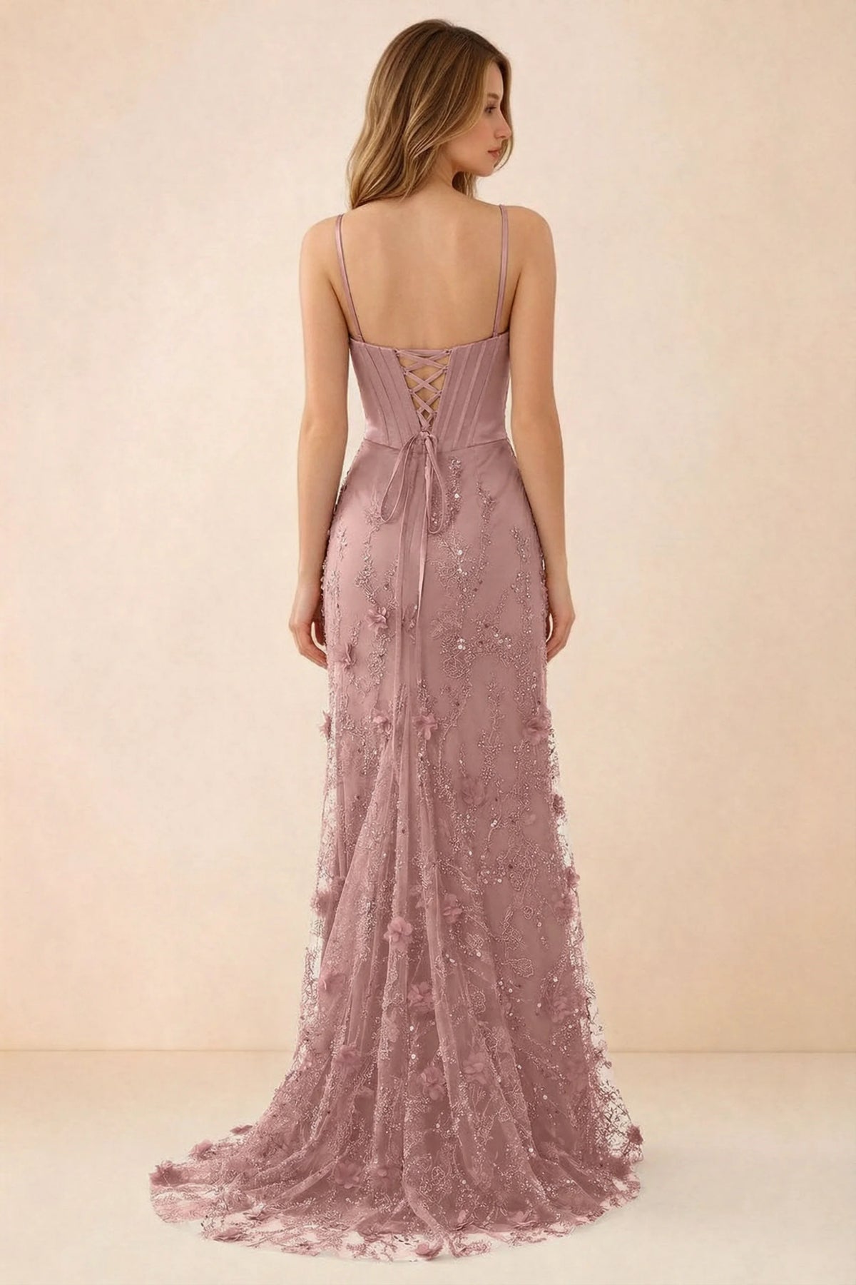 Rear studio view of Beth pink dress showing corset back lacing and a trailing floral hem