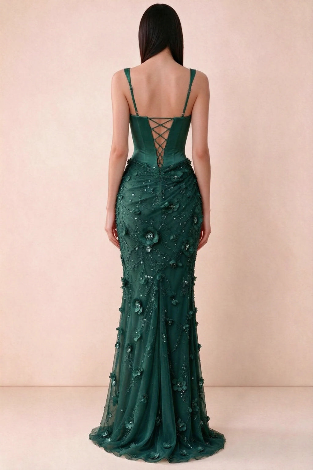 Rear studio view of Betsy emerald green dress showing adjustable shoulder straps and corset back lacing