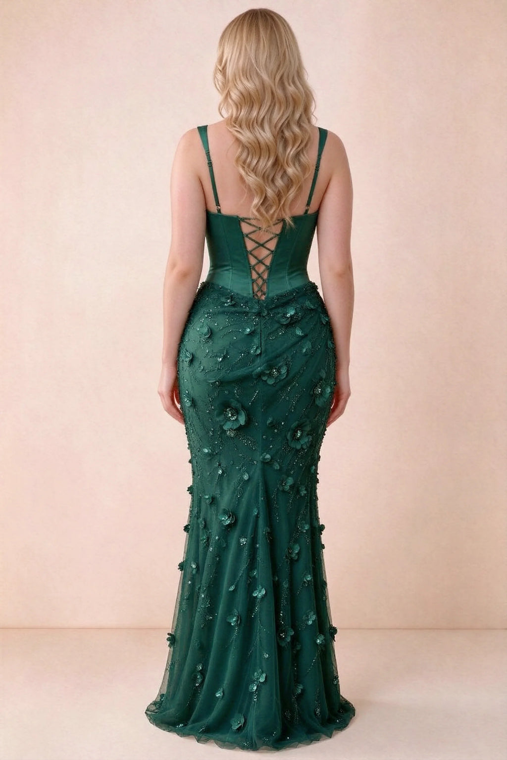 Rear studio view of Betsy emerald green dress showing the broad straps and fitted floral skirt