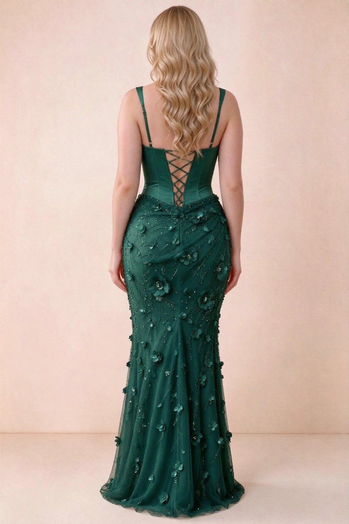 Rear studio view of Betsy emerald green dress showing the broad straps and fitted floral skirt