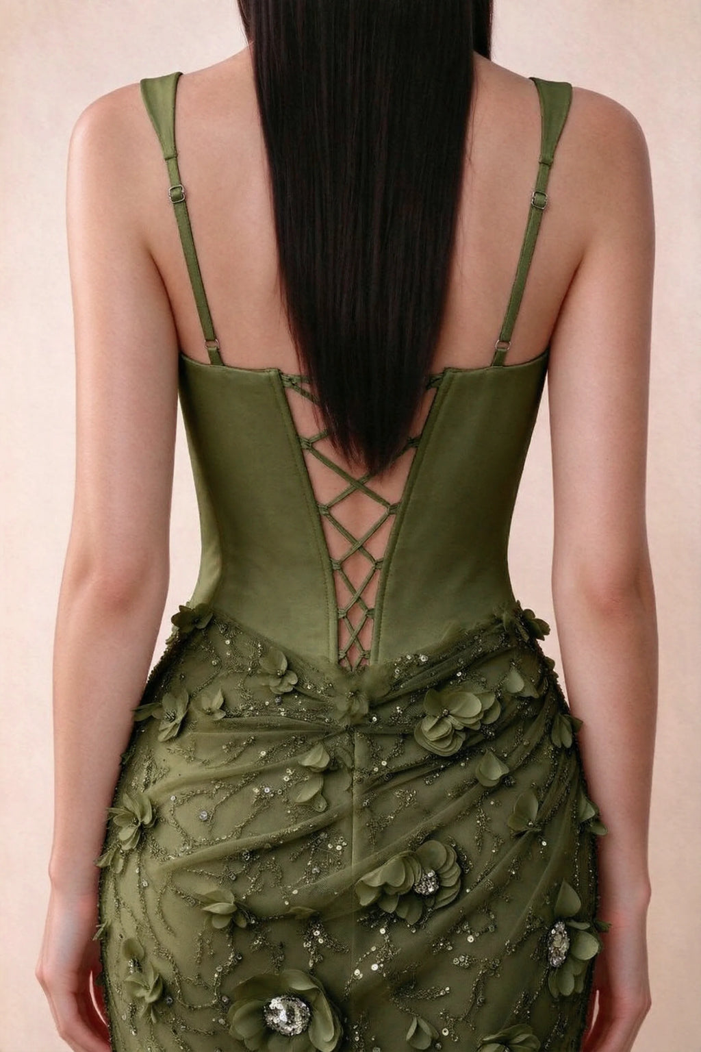 Close-up of Betsy olive adjustable strap sliders and crossed back lacing above the beaded skirt