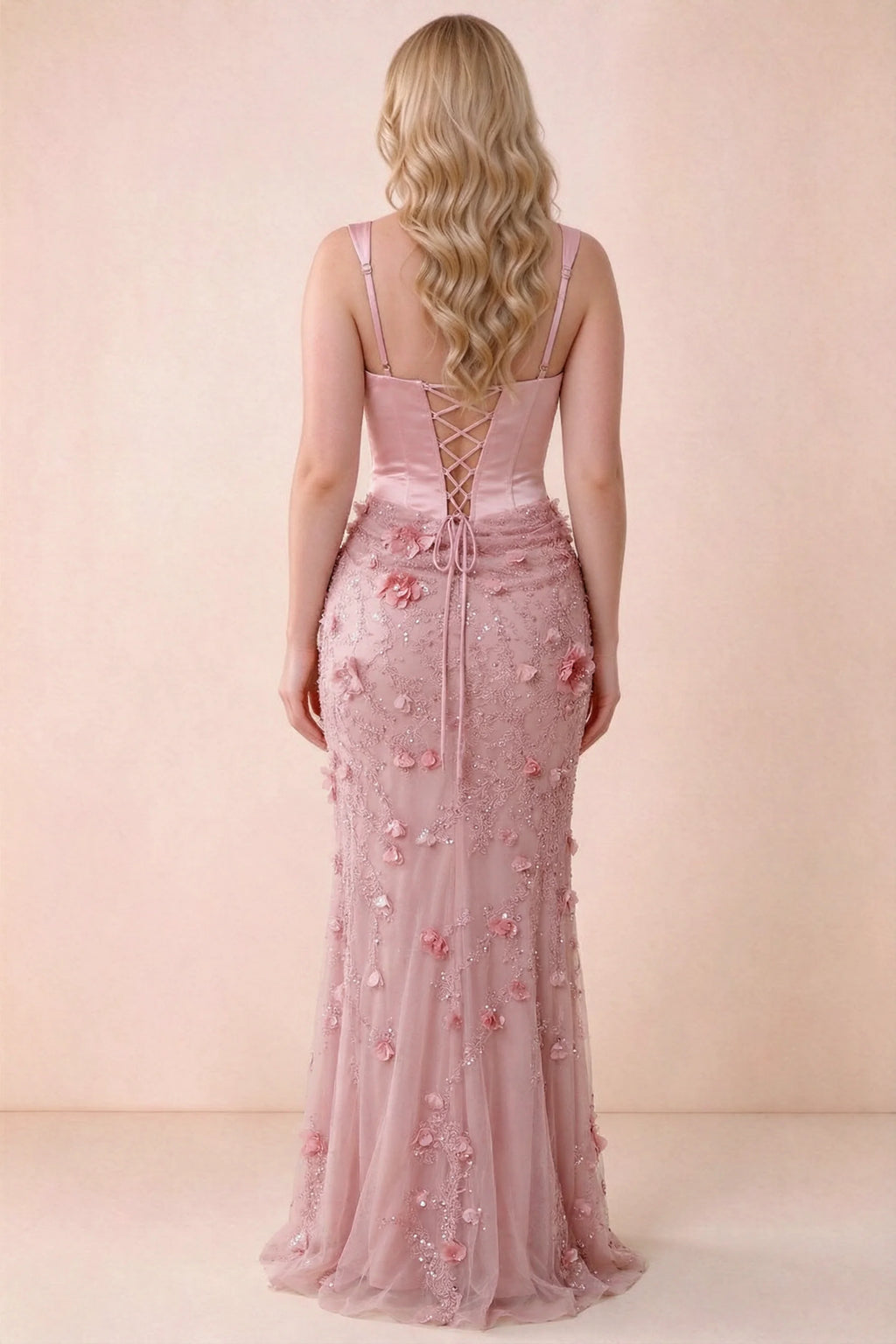 Rear studio view of Betsy pink dress showing the broad straps and fitted floral skirt