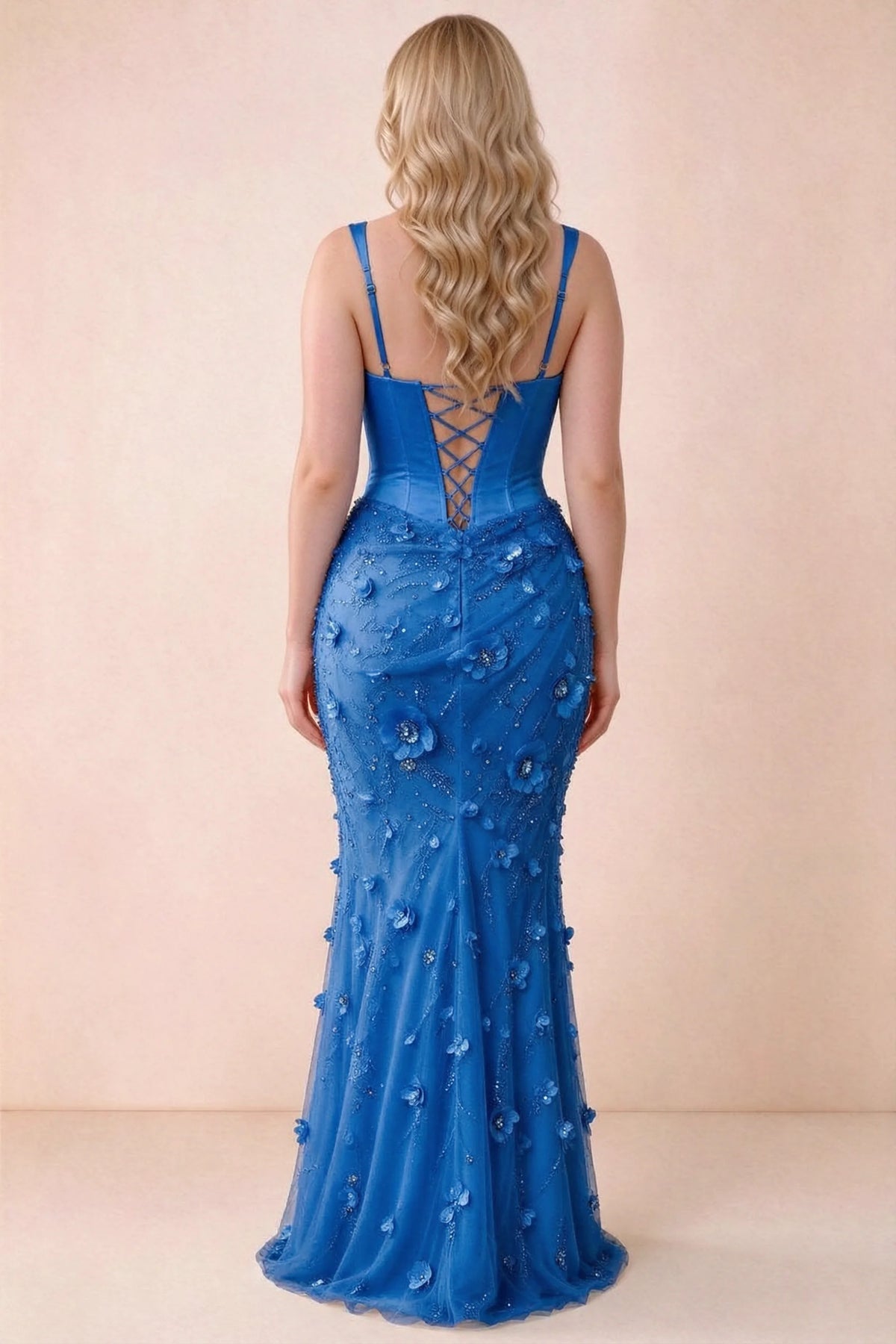 Rear studio view of Betsy royal blue dress showing the broad straps and fitted floral skirt