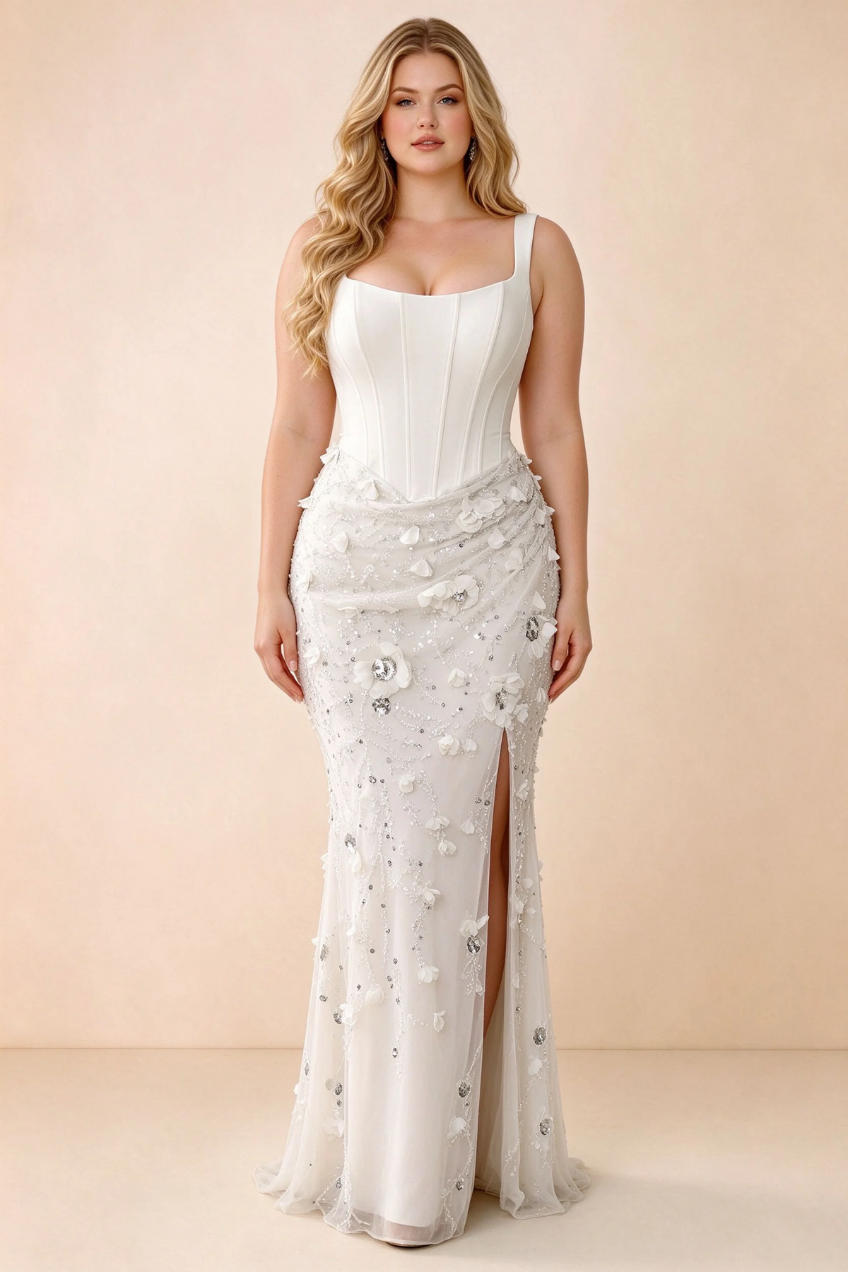Front studio view of Betsy white maxi dress with a pointed corset waist and embellished skirt