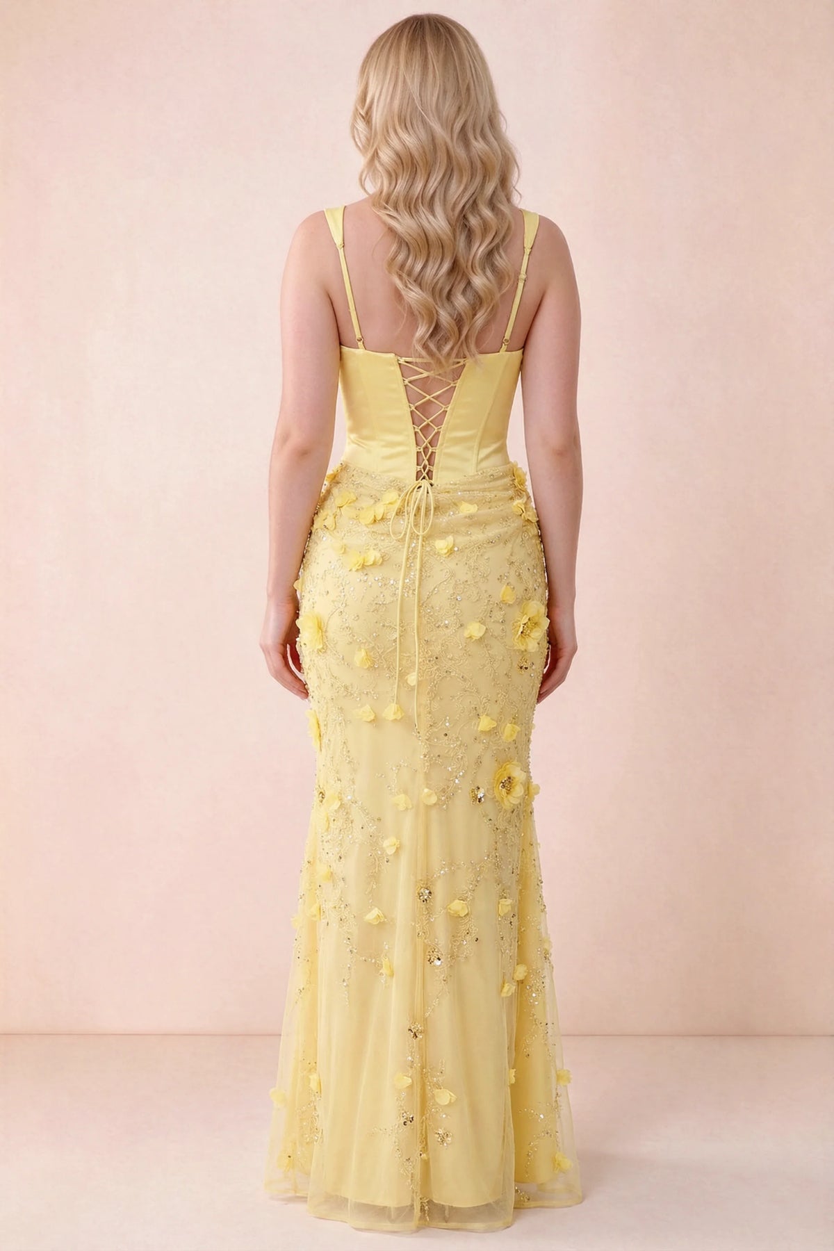 Rear studio view of Betsy yellow dress showing the broad straps and fitted floral skirt