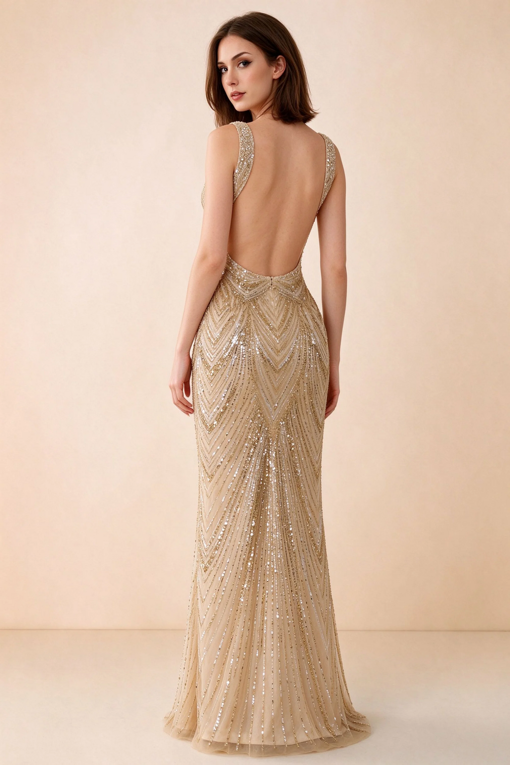 Rear studio view of Betty champagne dress showing wide shoulder straps and a low scooped open back