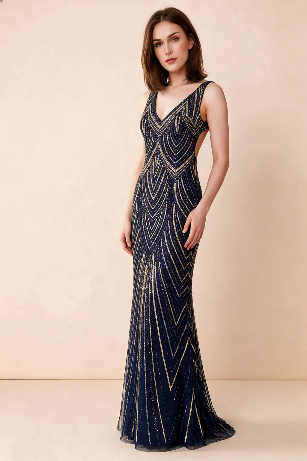 Front studio view of Betty navy and gold sequin maxi dress showing the V-neck and geometric pattern