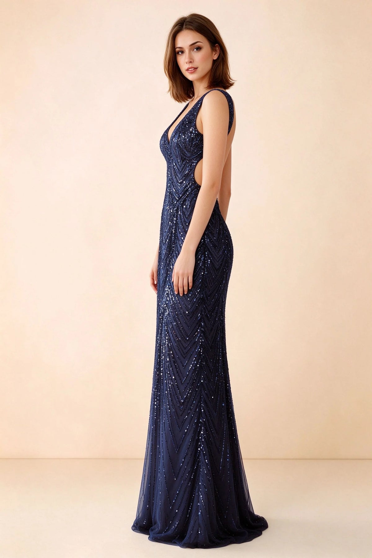 Three-quarter studio view of Betty navy dress showing the fitted hips and gently flared hem