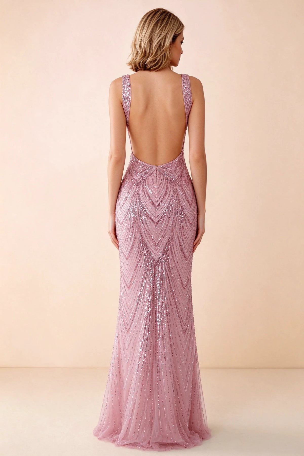 Rear studio view of Betty pink dress showing wide shoulder straps and a low scooped open back