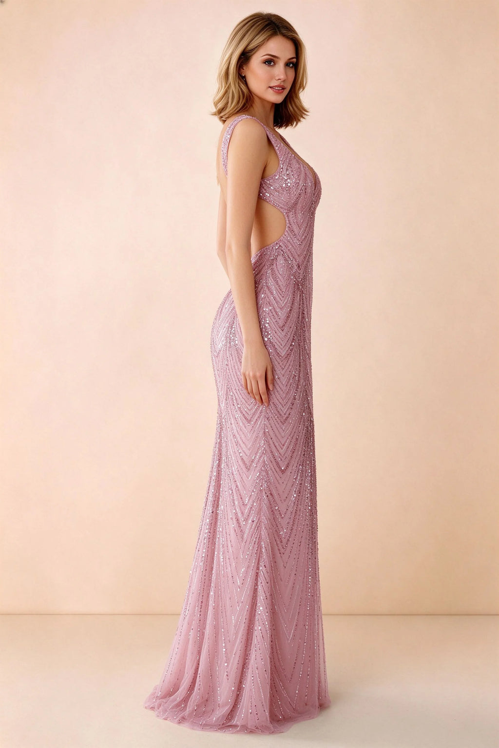 Three-quarter studio view of Betty pink dress showing the fitted hips and gently flared hem